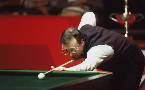 A man playing snooker